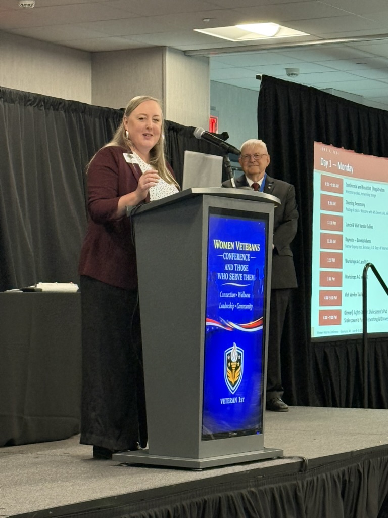 Women Veterans Conference 2026 — Speaker at podium