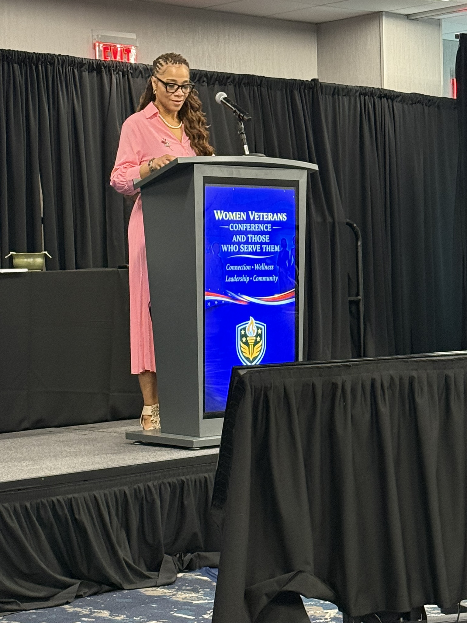 Women Veterans Conference 2026 — Speaker at podium