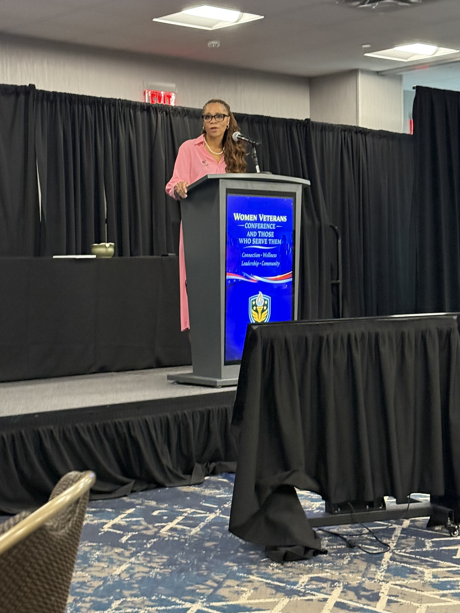Women Veterans Conference 2026 — Speaker at podium