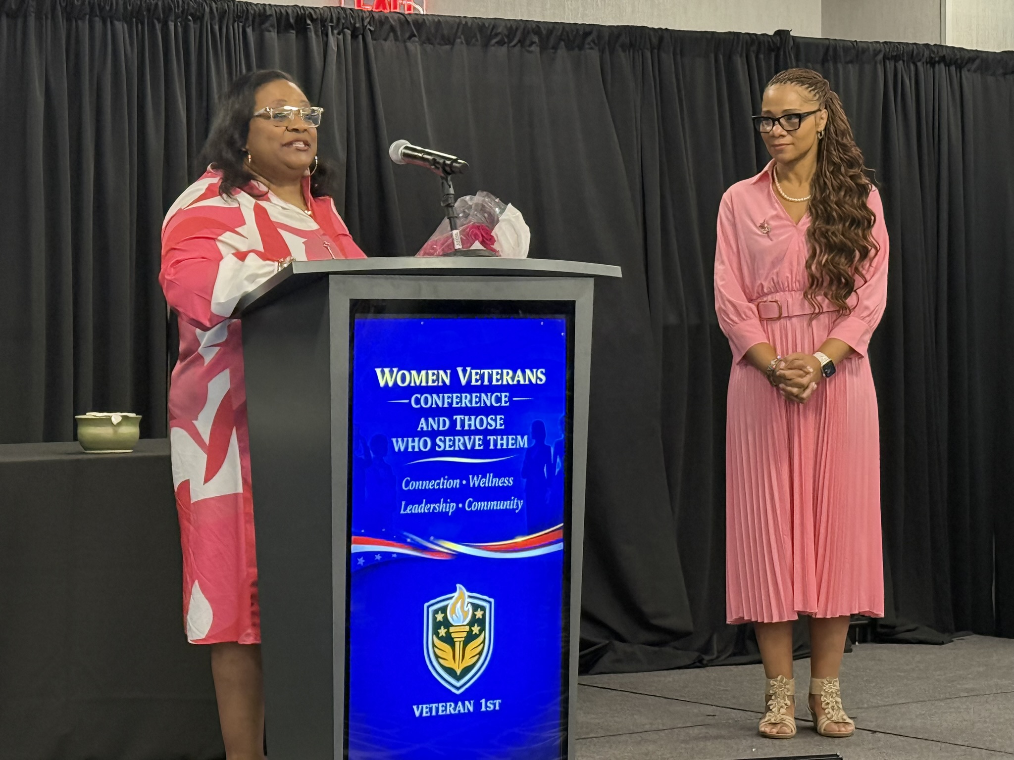 Women Veterans Conference 2026 — Two speakers podium