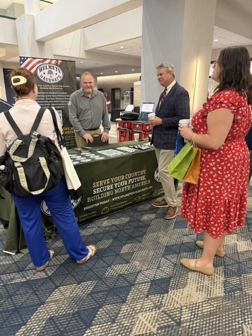 Women Veterans Conference 2026 — Vendor booth conversation
