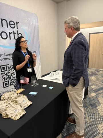 Women Veterans Conference 2026 — Vendor booth conversation