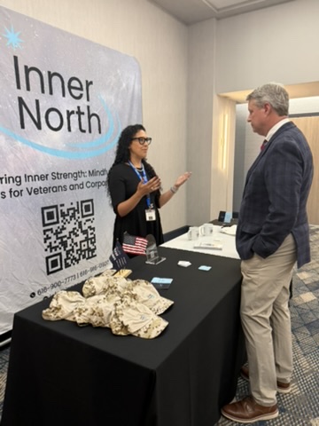 Women Veterans Conference 2026 — Vendor booth conversation