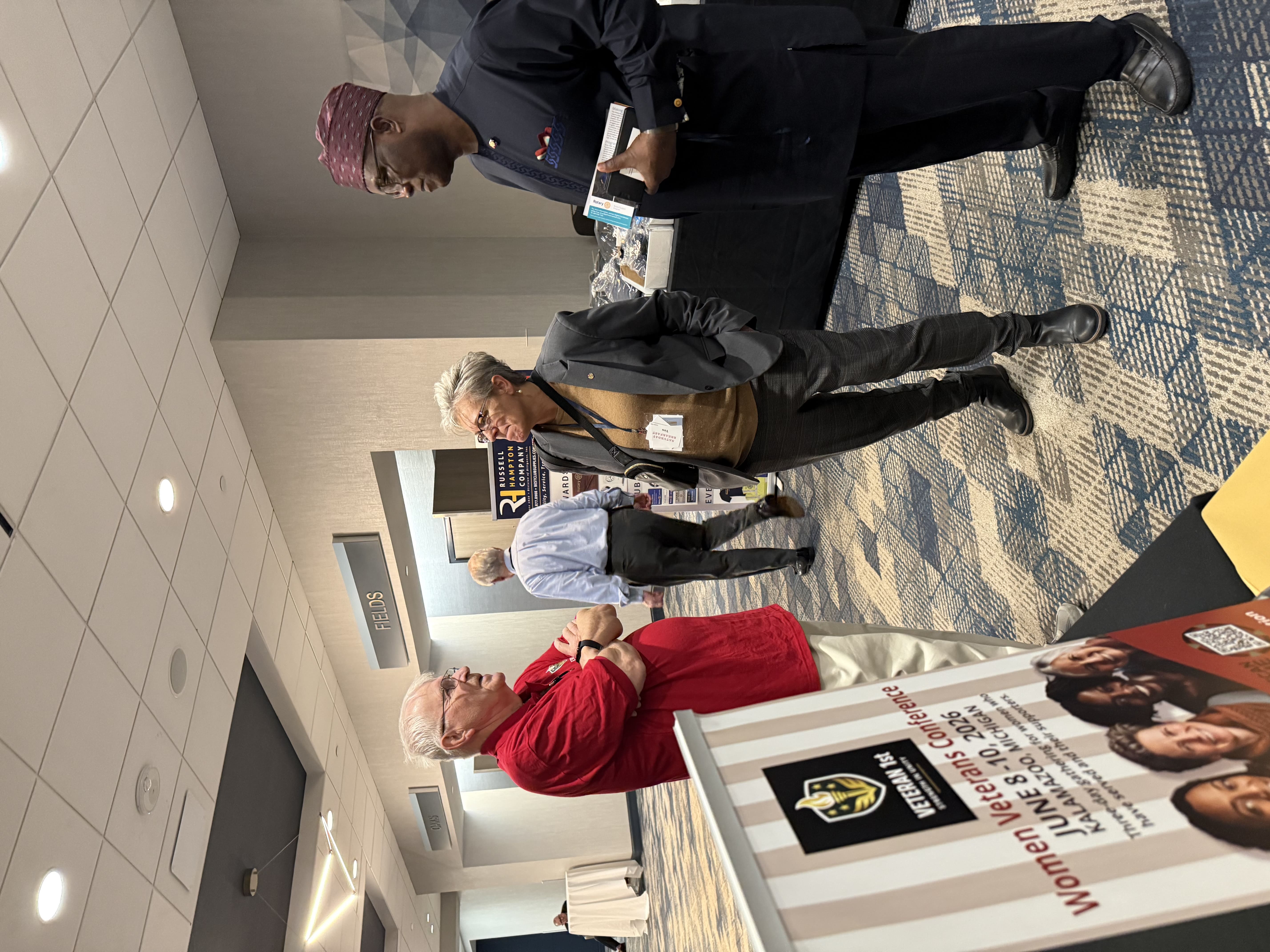 Chatting at conference booth